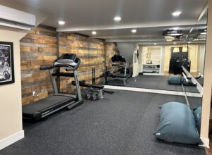 Best basement remodel in Frederick area by Talon Construction Inc with a home gym